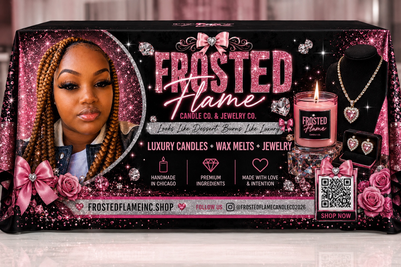 Nana, founder of Frosted Flame, surrounded by pink sparkle, candles and jewelry